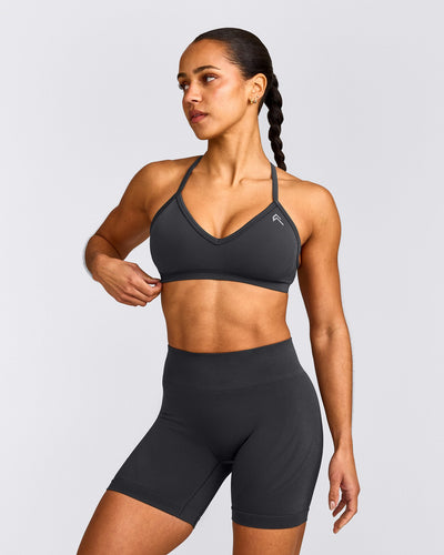 EnhanceLift™ Seamless Strappy Sports Bra with Grey Logo | Coal