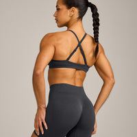 EnhanceLift™ Seamless Strappy Sports Bra with Grey Logo | Coal