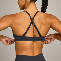 EnhanceLift™ Seamless Strappy Sports Bra with Grey Logo | Coal