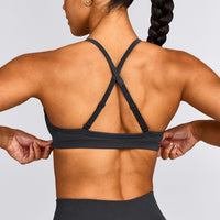 EnhanceLift™ Seamless Strappy Sports Bra with Grey Logo | Coal