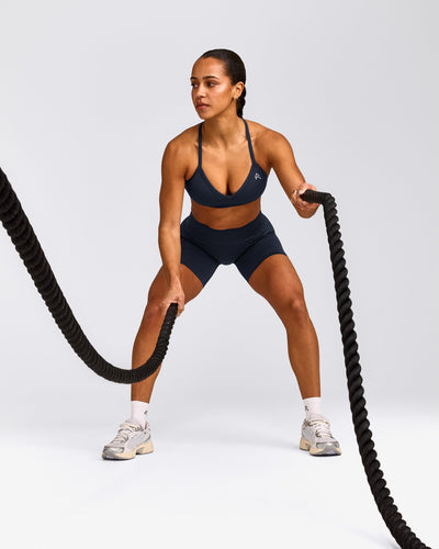 EnhanceLift™ Seamless Strappy Sports Bra with Grey Logo | True Blue