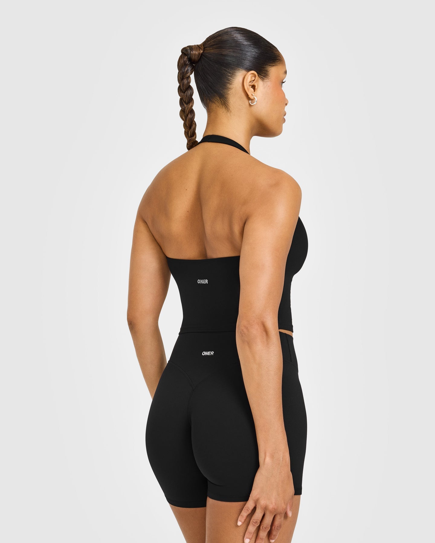 SoftMotion™ Halter Neck Mid Vest with Built in Bra Shelf with White Logo | Black