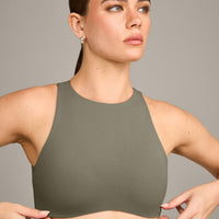 SoftMotion™ High Neck Sports Bra with Grey Logo | Alpine Green