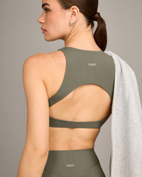SoftMotion™ High Neck Sports Bra with Grey Logo | Alpine Green