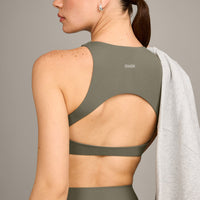 SoftMotion™ High Neck Sports Bra with Grey Logo | Alpine Green