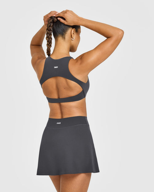 SoftMotion™ High Neck Sports Bra with White Logo | Coal