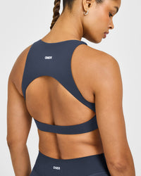 SoftMotion™ High Neck Sports Bra with White Logo | True Blue