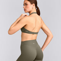 SoftMotion™ Minimal Halter Neck Bralette with Gray Logo | Alpine Green