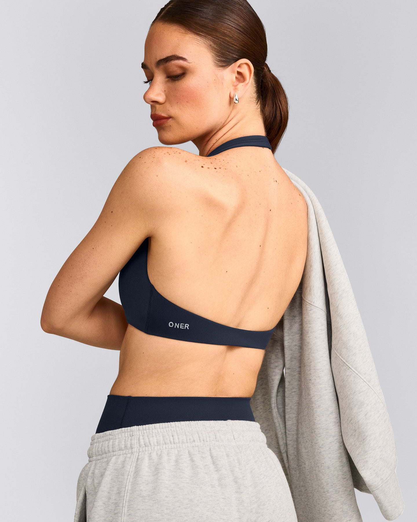 SoftMotion™ Minimal Halter Neck Bralette with Grey Logo | True Blue