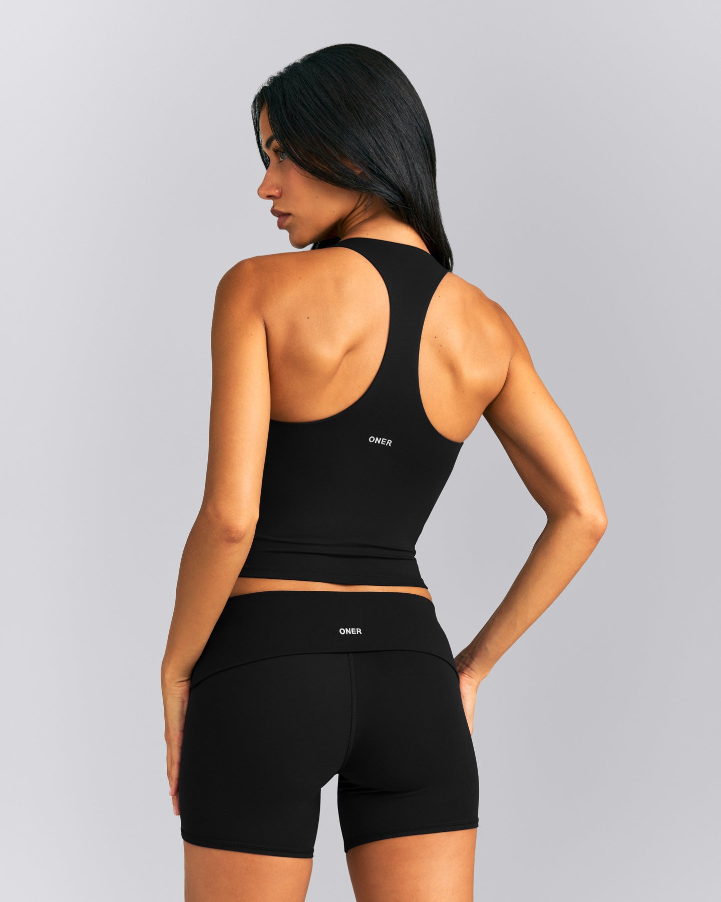 SoftMotion™ Racer Back Mid Tank Top with Built in Bra Shelf New Branding | Black
