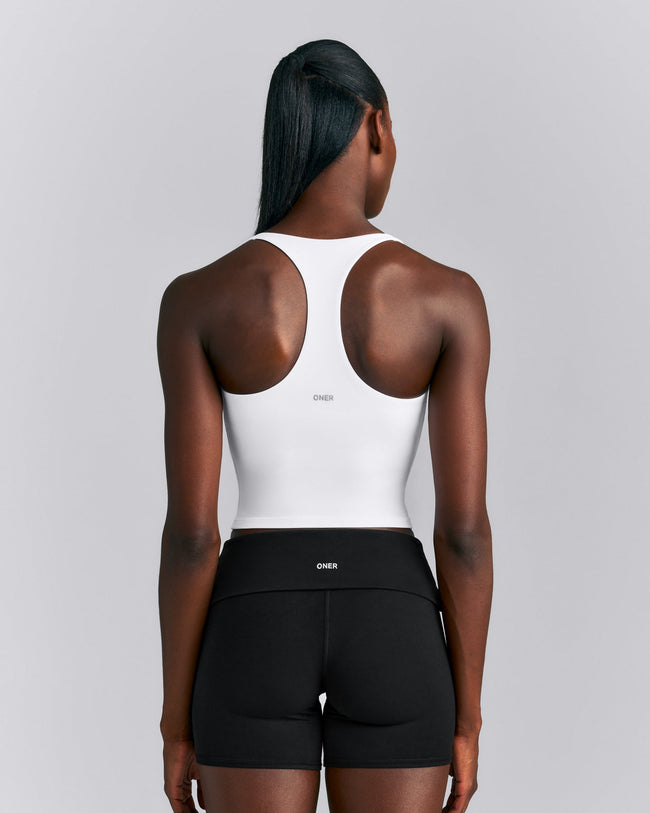 SoftMotion™ Racer Back Mid Tank Top with Built in Bra Shelf New Branding | White
