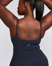 SoftMotion™ Strappy Mid Vest with Built in Bra Shelf with Grey Logo | True Blue