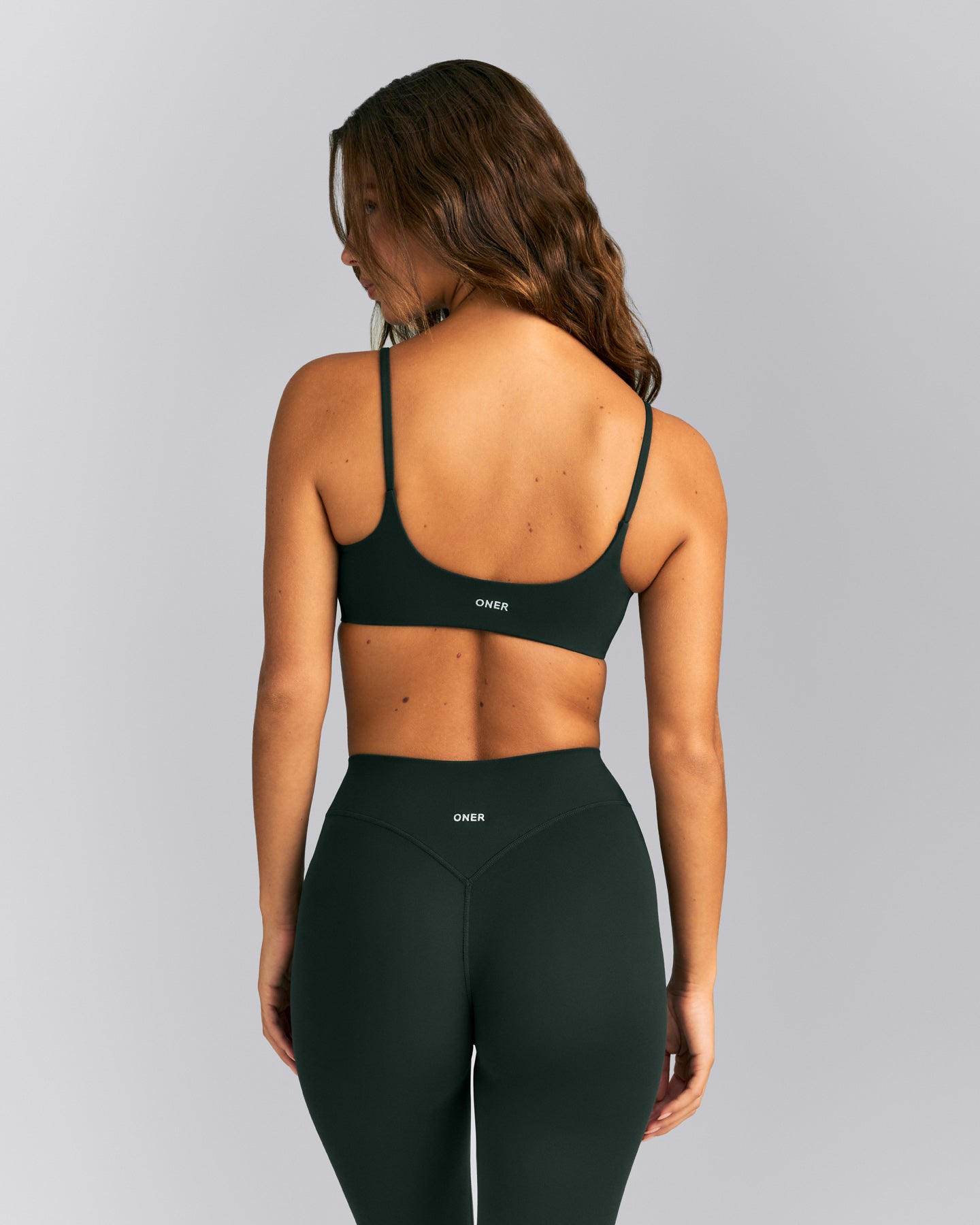 SoftMotion™ Strappy Sports Bra | Emerald Noir
