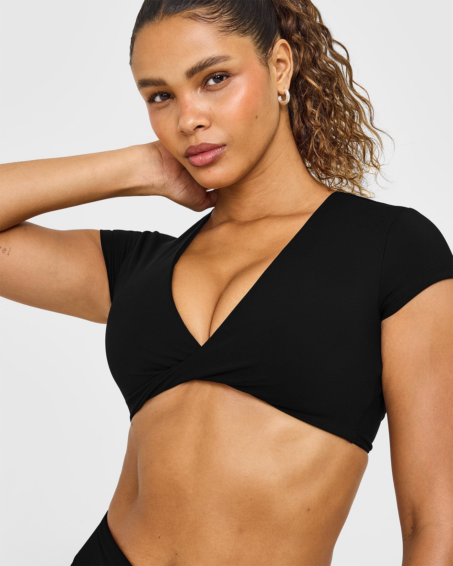 Unified Twist Front Short Sleeve Crop Top White Logo | Black