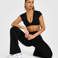 Unified Twist Front Short Sleeve Crop Top White Logo | Black