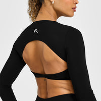 Unified Twist Front Long Sleeve Crop Top White Logo | Black