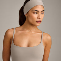 SoftMotion™ Headband with White Logo | Warm Sand