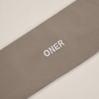 SoftMotion™ Headband with White Logo | Warm Sand