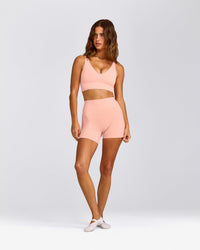 SoftMotion™ Longline Sports Bra with Grey Logo | Peach Orange