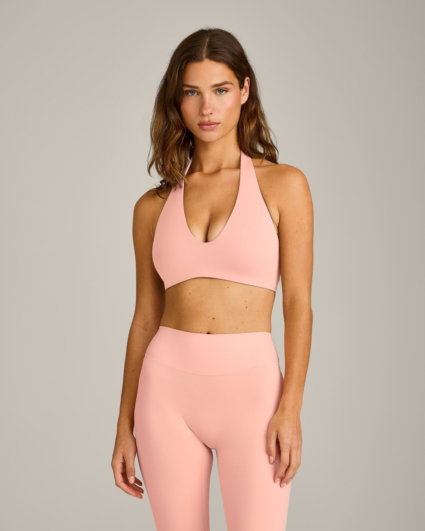 SoftMotion™ Minimal Halter Neck Bralette with Grey Logo | Peach Orange
