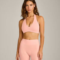 SoftMotion™ Minimal Halter Neck Bralette with Grey Logo | Peach Orange
