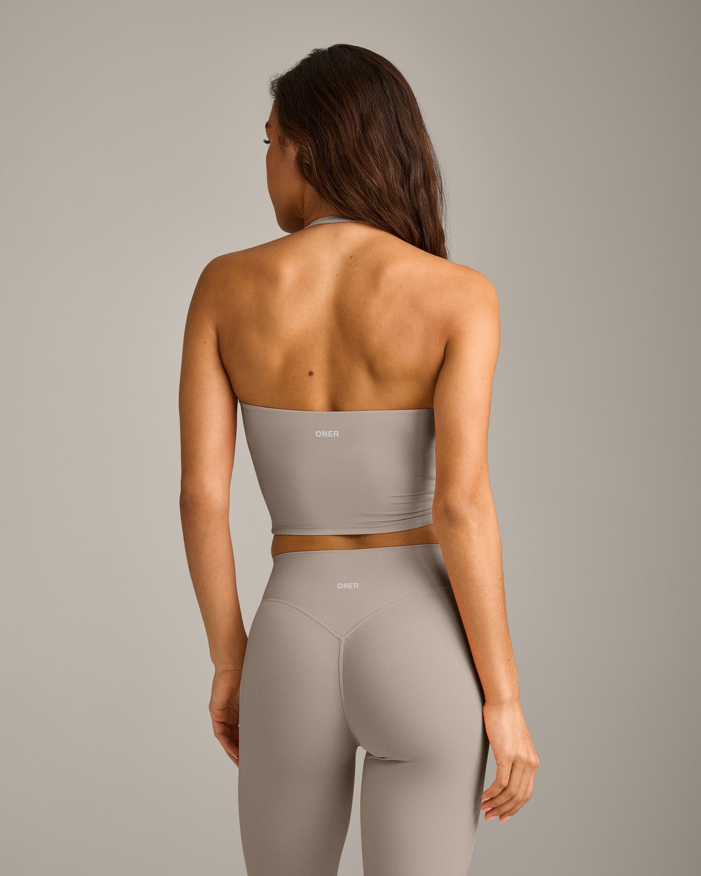 SoftMotion™ Strappy Halter Neck Mid Vest with Built in Bra Shelf with White Logo | Warm Sand