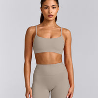 SoftMotion™ Strappy Sports Bra with White Logo | Warm Sand