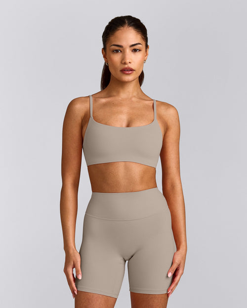 SoftMotion™ Strappy Sports Bra with White Logo | Warm Sand
