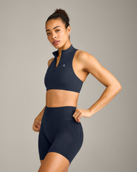 EasyLift™ Zip High Neck Sports Bra with Grey Logo | True Blue