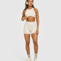 SoftMotion™ High Neck Sports Bra with White Logo | Sand