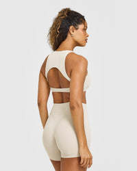 SoftMotion™ High Neck Sports Bra with White Logo | Sand