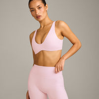 SoftMotion™ Scoop Back Bralette with Grey Logo | Soft Girl Pink