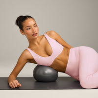SoftMotion™ Scoop Back Bralette with Grey Logo | Soft Girl Pink