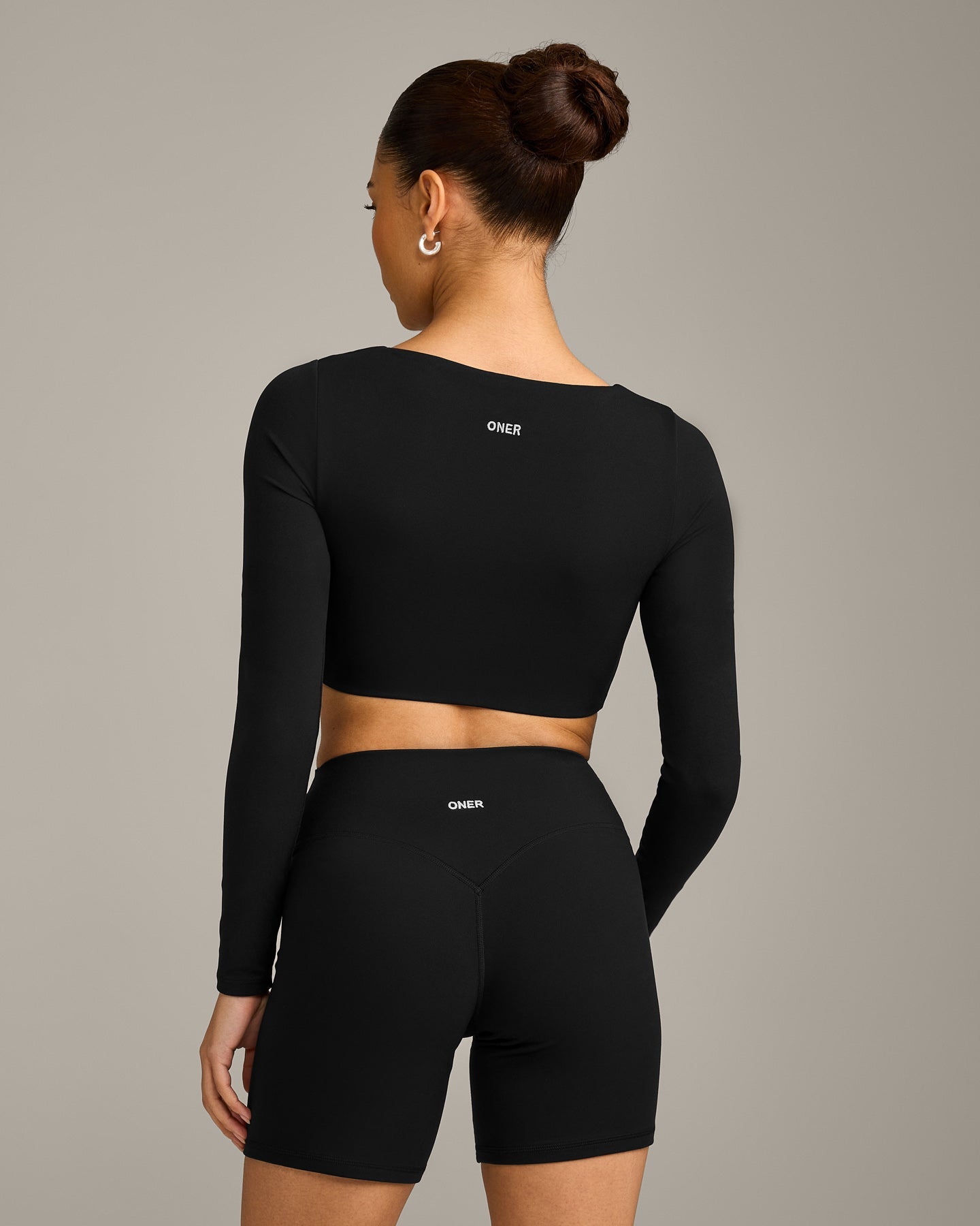 SoftMotion™ Scoop Neck Long Sleeve Crop Top with Built in Bra Shelf with Grey Logo | Black
