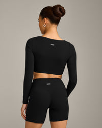 SoftMotion™ Scoop Neck Long Sleeve Crop Top with Built in Bra Shelf with Grey Logo | Black