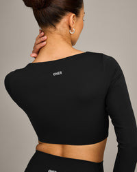 SoftMotion™ Scoop Neck Long Sleeve Crop Top with Built in Bra Shelf with Grey Logo | Black