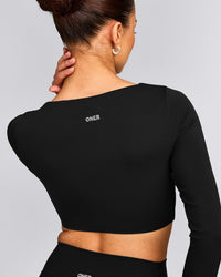 SoftMotion™ Scoop Neck Long Sleeve Crop Top with Built in Bra Shelf with Grey Logo | Black