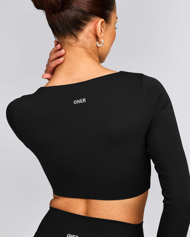 SoftMotion™ Scoop Neck Long Sleeve Crop Top with Built in Bra Shelf with Grey Logo | Black