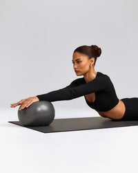 SoftMotion™ Scoop Neck Long Sleeve Crop Top with Built in Bra Shelf with Grey Logo | Black