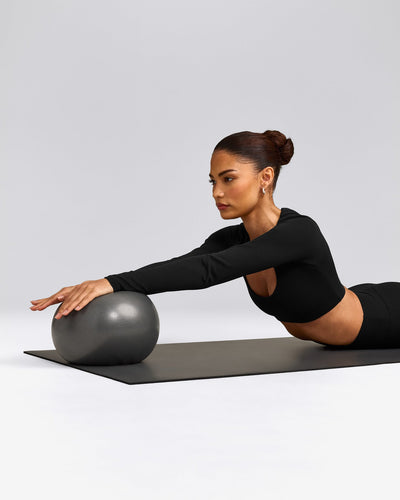 SoftMotion™ Scoop Neck Long Sleeve Crop Top with Built in Bra Shelf with Grey Logo | Black
