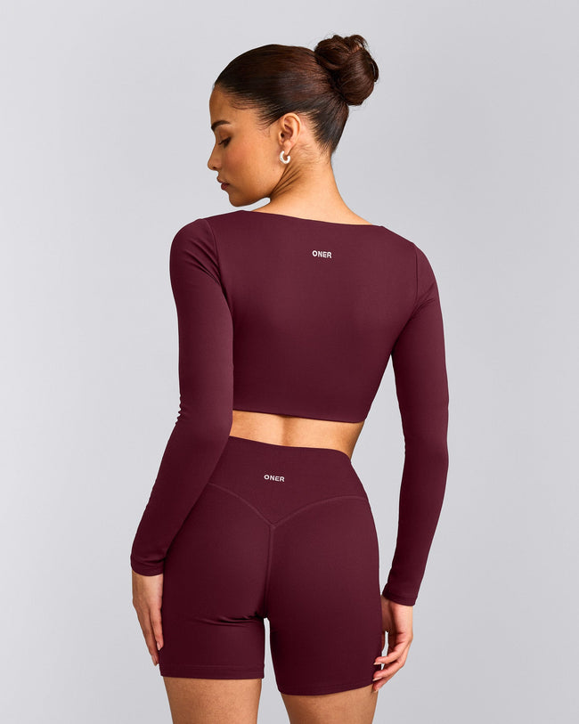 SoftMotion™ Scoop Neck Long Sleeve Crop Top with Built in Bra Shelf with Gray Logo | Cherry Lacquer Purple