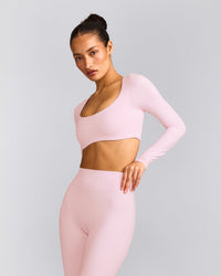 SoftMotion™ Scoop Neck Long Sleeve Crop Top with Built in Bra Shelf with Grey Logo | Soft Girl Pink