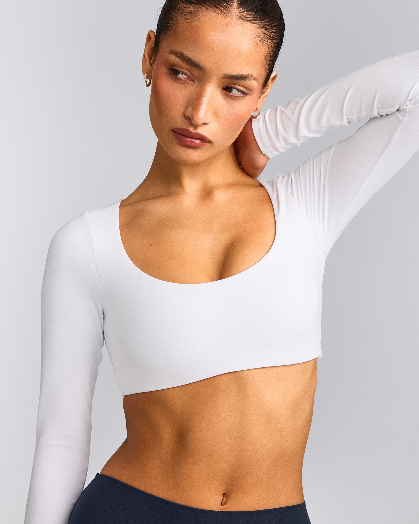 SoftMotion™ Scoop Neck Long Sleeve Crop Top with Built in Bra Shelf with Gray Logo | White