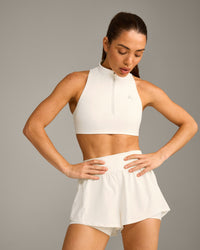 EasyLift™ Zip High Neck Sports Bra with Grey Logo | Marshmallow White