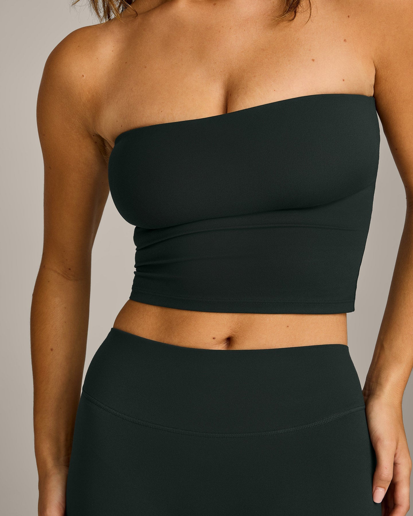 SoftMotion™ Bandeau Mid Vest with Built in Bra Shelf with Grey Logo | Emerald Noir