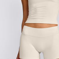 SoftMotion™ Double Layer Mid Rise Micro Shorts 4" with Grey Logo | Marshmallow White