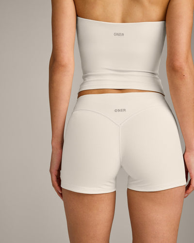 SoftMotion™ Double Layer Mid Rise Shorts 4" with Grey Logo | Marshmallow White