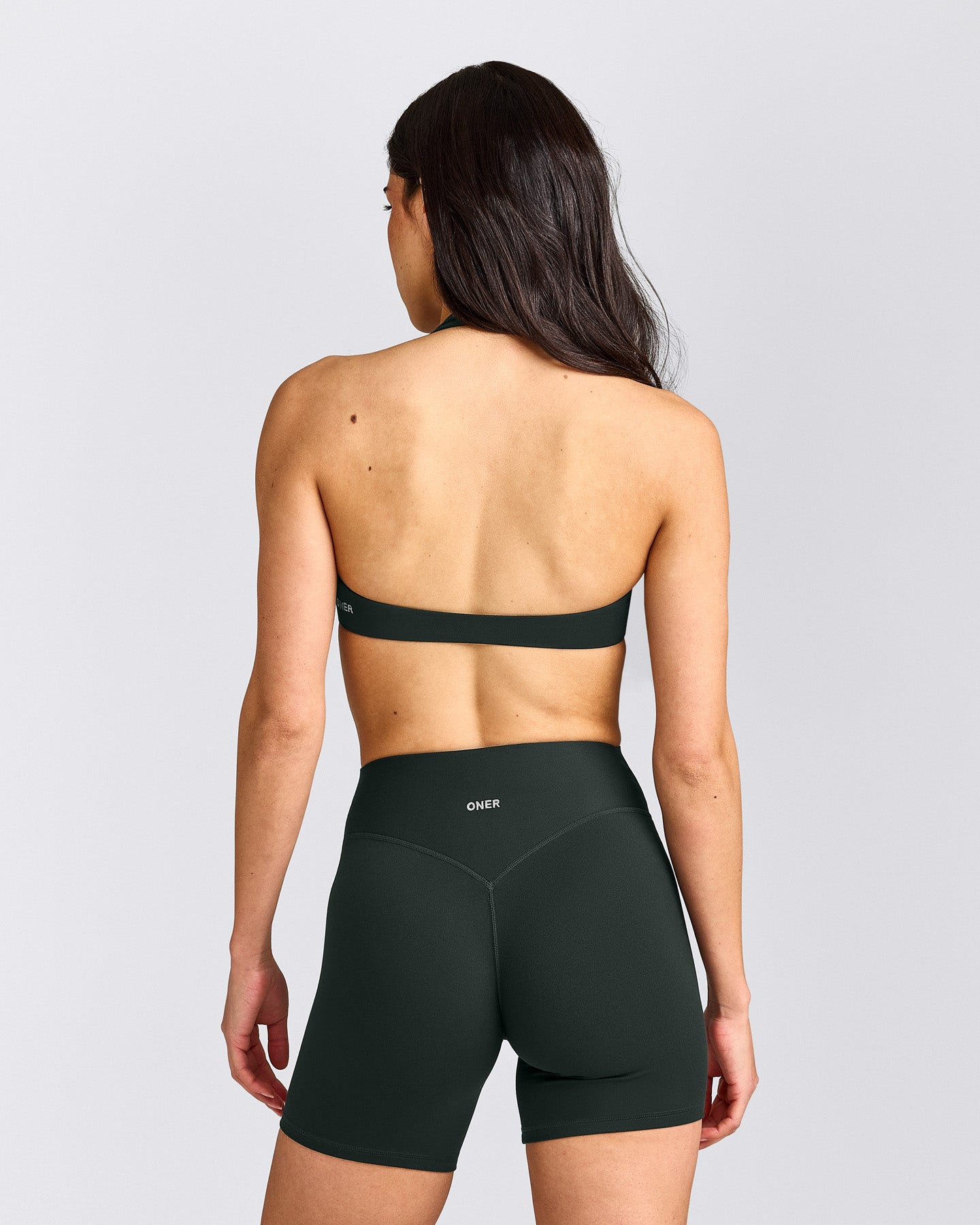 SoftMotion™ Minimal Halter Neck Bralette with Gray Logo | Emerald Noir