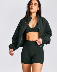 SoftMotion™ Minimal Halter Neck Bralette with Gray Logo | Emerald Noir