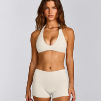 SoftMotion™ Minimal Halter Neck Bralette with Grey Logo | Marshmallow White